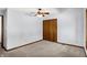 Bright carpeted bedroom with ceiling fan and closet with sliding doors at 10560 Lighthouse Way, Indianapolis, IN 46256