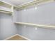 Walk-in closet features built-in shelving and ample storage space at 10560 Lighthouse Way, Indianapolis, IN 46256