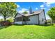 Exterior of house featuring backyard, screened-in porch, and wood deck at 10560 Lighthouse Way, Indianapolis, IN 46256