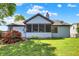 This home boasts a screened-in porch, a wooden deck and beautiful backyard at 10560 Lighthouse Way, Indianapolis, IN 46256
