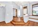 Inviting foyer with hardwood floors, a stylish front door, and lots of natural light at 10560 Lighthouse Way, Indianapolis, IN 46256