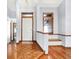 Bright foyer with hardwood floors, light-colored walls, and wooden trim accents at 10560 Lighthouse Way, Indianapolis, IN 46256