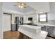 Bright kitchen with island, stainless steel appliances, and recessed lighting at 10560 Lighthouse Way, Indianapolis, IN 46256