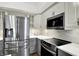 Updated kitchen with stainless steel appliances and modern countertops at 10560 Lighthouse Way, Indianapolis, IN 46256