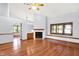 Spacious living room features hardwood floors, vaulted ceilings, and a cozy fireplace at 10560 Lighthouse Way, Indianapolis, IN 46256