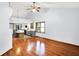 Living room featuring hardwood floors and an open layout to the modern kitchen at 10560 Lighthouse Way, Indianapolis, IN 46256