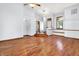 Bright living room featuring hardwood floors, modern lighting, and an inviting, open layout at 10560 Lighthouse Way, Indianapolis, IN 46256