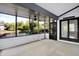 Inviting sunroom with scenic water views, fan, and access to the outdoors at 10560 Lighthouse Way, Indianapolis, IN 46256