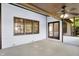 Relaxing sunroom with fan, white paneling, and sliding glass doors at 10560 Lighthouse Way, Indianapolis, IN 46256
