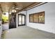Cozy sunroom with welcome sign, windows, and access to outside at 10560 Lighthouse Way, Indianapolis, IN 46256