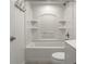 Clean bathroom with a shower and tub combination boasts sleek fixtures and hardware at 10833 Marquette Rd, Zionsville, IN 46077
