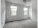 Light and airy bedroom with plush carpeting and neutral walls has great natural light at 10833 Marquette Rd, Zionsville, IN 46077