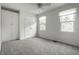 Carpeted bedroom with two windows, a closet, and neutral paint is move in ready! at 10833 Marquette Rd, Zionsville, IN 46077