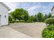 Large concrete driveway bordered by landscaping, offering ample parking near a well-maintained home at 10833 Marquette Rd, Zionsville, IN 46077