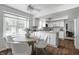 Spacious kitchen with a dining nook, white cabinets, and ample natural light from a large window at 10833 Marquette Rd, Zionsville, IN 46077