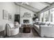 Inviting living room with white brick fireplace, beamed ceiling, and a large window for natural light at 10833 Marquette Rd, Zionsville, IN 46077