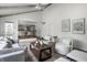 Open concept living room with stylish furnishings and hardwood floors, leads into dining area at 10833 Marquette Rd, Zionsville, IN 46077