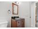 Bathroom featuring dark wood vanity with granite countertop and tile flooring at 11123 Haverstick Rd, Carmel, IN 46033