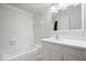 Classic white bathroom featuring a tub, shower, and a vanity with storage at 11123 Haverstick Rd, Carmel, IN 46033