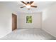 Bedroom featuring neutral tones, carpet, closet, and a window at 11123 Haverstick Rd, Carmel, IN 46033