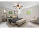 Cozy bedroom with neutral tones, updated ceiling fan, and natural light at 11123 Haverstick Rd, Carmel, IN 46033