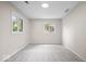 Neutral bedroom featuring a plush carpet and two windows providing natural light at 11123 Haverstick Rd, Carmel, IN 46033