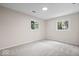 Neutral bedroom featuring a plush carpet and two windows providing natural light at 11123 Haverstick Rd, Carmel, IN 46033