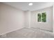 Neutral bedroom featuring a plush carpet and a window providing natural light at 11123 Haverstick Rd, Carmel, IN 46033