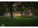 Charming single-story home featuring a lush green lawn and beautiful mature trees at 11123 Haverstick Rd, Carmel, IN 46033