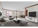 Staged living room with sectional sofa, decor, and adjacent dining area at 11123 Haverstick Rd, Carmel, IN 46033