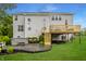 Backyard featuring a deck, patio, hot tub, lawn, and stairs leading to the house at 11552 Buckskin Dr, Zionsville, IN 46077