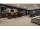Finished basement features a bar with wood bar and ample storage, perfect for entertaining guests at 11552 Buckskin Dr, Zionsville, IN 46077