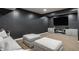 The finished basement features a cozy media room with comfortable seating and modern entertainment options at 11552 Buckskin Dr, Zionsville, IN 46077