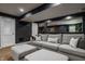 This renovated basement provides a living room with modern furnishings, enhancing comfort and style at 11552 Buckskin Dr, Zionsville, IN 46077