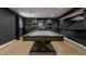 Basement rec room features a pool table, creating an inviting space for recreation and relaxation at 11552 Buckskin Dr, Zionsville, IN 46077