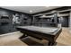 The finished basement boasts a recreation area with a pool table, perfect for leisure and gatherings at 11552 Buckskin Dr, Zionsville, IN 46077