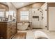 Bright bathroom featuring marble floors, standalone tub and glass enclosed shower with black hardware at 11552 Buckskin Dr, Zionsville, IN 46077