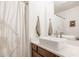 Bathroom featuring a vessel sink, a wooden vanity, a large mirror, and a walk-in shower at 11552 Buckskin Dr, Zionsville, IN 46077