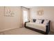 Light bedroom with a daybed and soft decor at 11552 Buckskin Dr, Zionsville, IN 46077