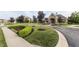 Community clubhouse with beautiful landscaping, a variety of colorful plants, and a well-manicured lawn at 11552 Buckskin Dr, Zionsville, IN 46077