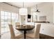 Dining area with sliding door and abundant natural light at 11552 Buckskin Dr, Zionsville, IN 46077