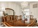 Elegant dining room with wood table, seating for ten, plus a decorative vase centerpiece at 11552 Buckskin Dr, Zionsville, IN 46077