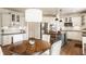 Eat-in kitchen features a central island and stainless steel appliances at 11552 Buckskin Dr, Zionsville, IN 46077