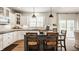 Bright kitchen with white cabinets and stainless steel appliances at 11552 Buckskin Dr, Zionsville, IN 46077