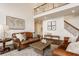 Open living room featuring high ceilings, wood floors, comfortable seating, and elegant decor at 11552 Buckskin Dr, Zionsville, IN 46077