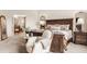 Relaxing main bedroom suite with neutral décor, a cozy sitting area, and an en-suite bathroom at 11552 Buckskin Dr, Zionsville, IN 46077