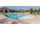 Community pool features lounge chairs and a splash pool surrounded by well-maintained landscaping at 11552 Buckskin Dr, Zionsville, IN 46077