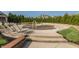 Neighborhood splash pool with lounge chairs on concrete at 11552 Buckskin Dr, Zionsville, IN 46077