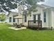 Charming backyard features a patio set with umbrella and a small deck adjacent to the house at 11700 Harvest Moon Dr, Noblesville, IN 46060
