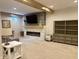 Finished basement area with an electric fireplace, built-in storage, and neutral carpeting at , Noblesville, IN 46060